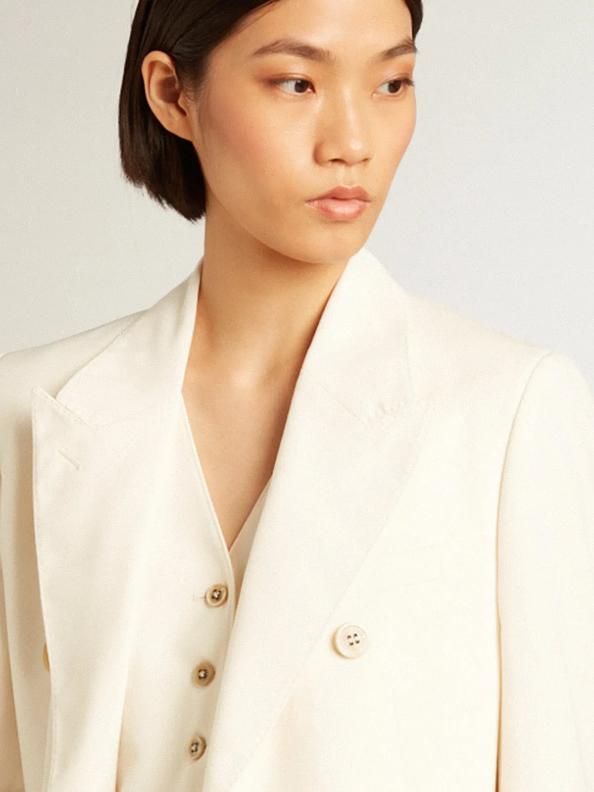 Women’s aged white double-breasted blazer