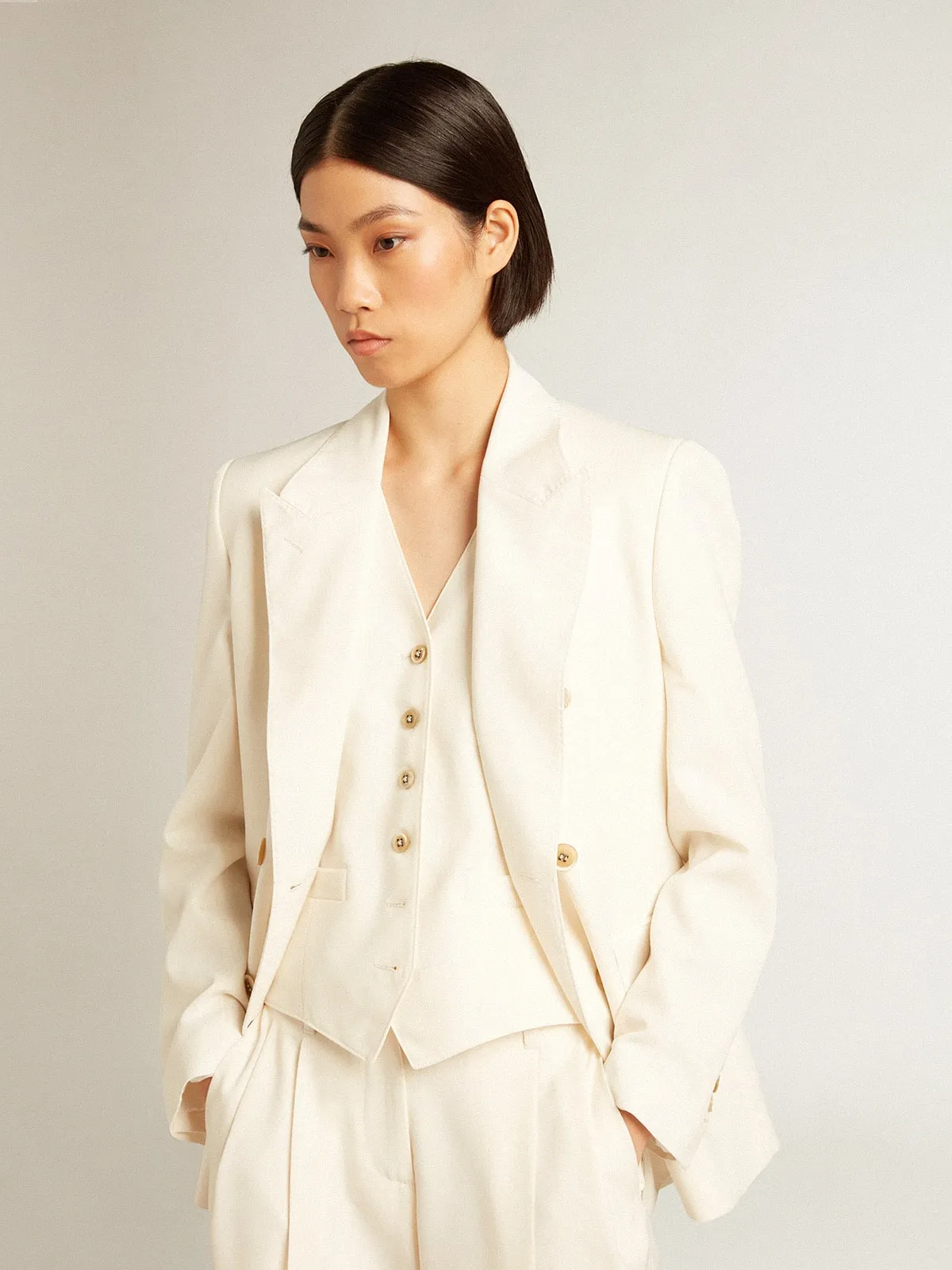 Women’s aged white double-breasted blazer